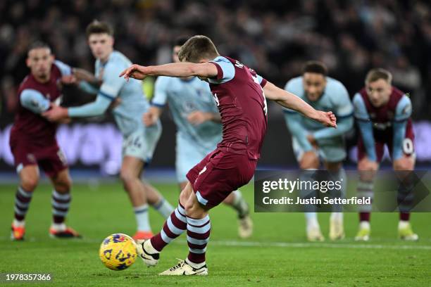 James Ward-Prowse of West Ham United scores his team's first goal from the penalty spot during the Premier League match between West Ham United and...