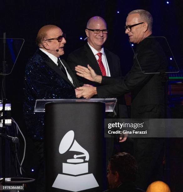 Tom Hanks, right, introduces Clive Davis during the 66th Grammy Awards Pre-Grammy Gala at the Beverly Hilton on February 3, 2024 in Beverly Hills,...