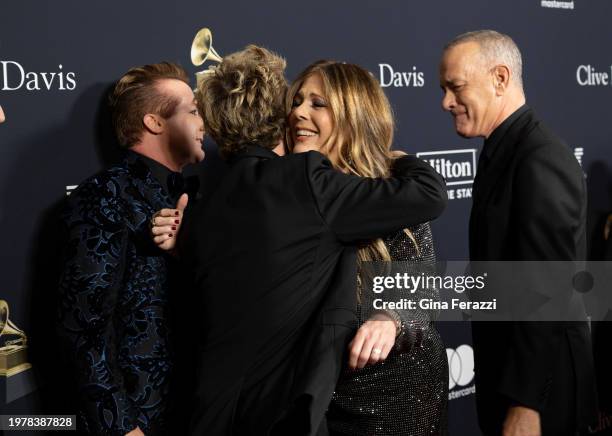 Rita Wilson and Tom Hanks run into Green Day on the red carpet of the 66th Grammy Awards Pre-Grammy Gala at the Beverly Hilton on February 3, 2024 in...