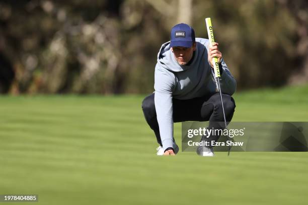 Former NFL quarterback Tom Brady lines up a putt on the 12th green during the first round of the AT&T Pebble Beach Pro-Am at Spyglass Hill Golf...