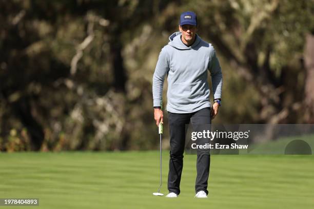 Former NFL quarterback Tom Brady prepares to putt on the 12th green during the first round of the AT&T Pebble Beach Pro-Am at Spyglass Hill Golf...