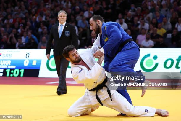 Serbia's Alexandar Kukolj fights against Ukraine's Anton Savytskiy in the men's -100kg bronze medal bout during the Paris Grand Slam judo tournament...