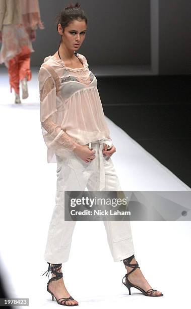 Model walks down the runway at the fait a main Spring/Summer 2003 Collection fashion show during the Hong Kong Collection in the Cargo Hall at the...