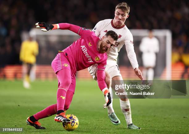 Jose Sa of Wolverhampton Wanderers on the ball whilst under pressure from Rasmus Hojlund of Manchester United during the Premier League match between...