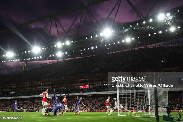 Gabriel of Arsenal taps the ball into the net for an own goal, allowing Liverpool to equalise at the end of the first half during the Premier League...