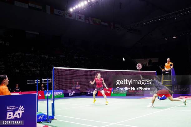 Supanida Katethong of Thailand is in action against Aya Ohori of Japan in the women's singles final match at the Badminton Princess Sirivannavari...