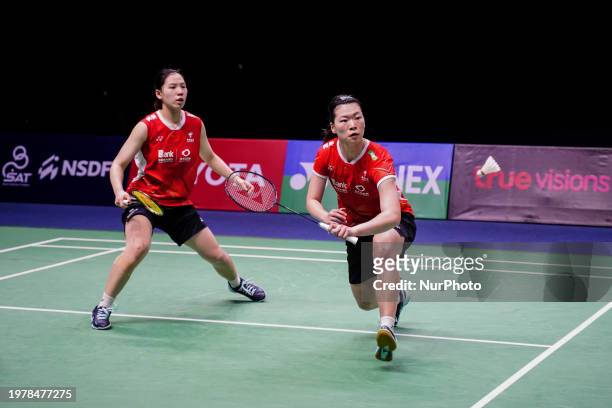 China's Li Yi Jing and Luo Xu Min are in action against Thailand's Benyapa Aimsaard and Nuntakarn Aimsaard in the women's doubles final match at the...
