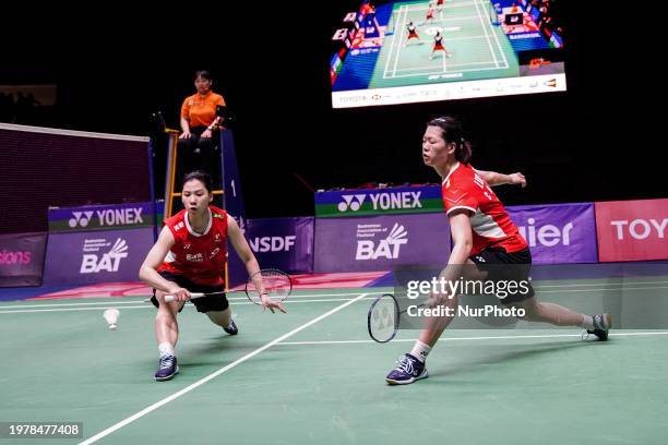 China's Li Yi Jing and Luo Xu Min are in action against Thailand's Benyapa Aimsaard and Nuntakarn Aimsaard in the women's doubles final match at the...