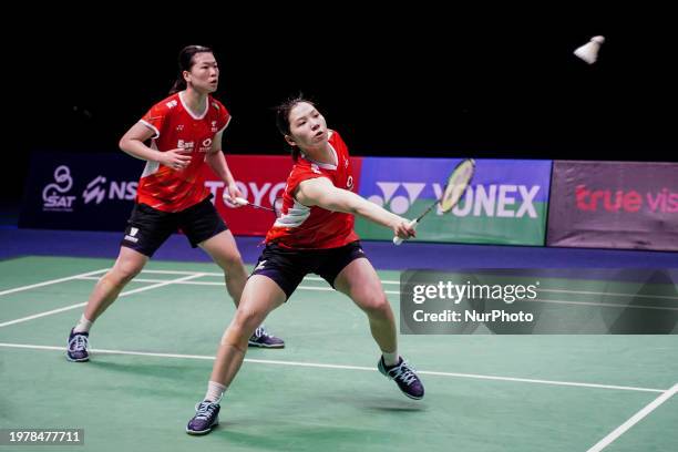 China's Li Yi Jing and Luo Xu Min are in action against Thailand's Benyapa Aimsaard and Nuntakarn Aimsaard in the women's doubles final match at the...