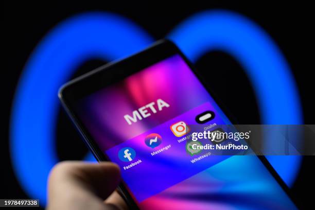 Meta social media icons are being displayed on a smartphone among Facebook, Messenger, Instagram, Threads, and other products, with the Meta icon...