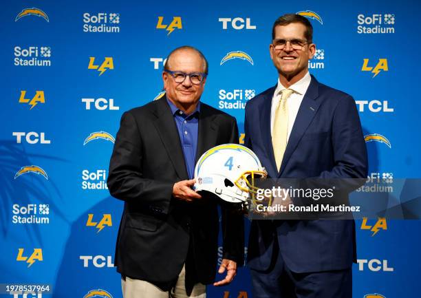 Owner and Chairman of the Board Dean Spanos and Newly appointed head coach Jim Harbaugh of the Los Angeles Chargers pose during a press conference at...