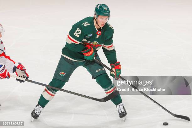 Matt Boldy of the Minnesota Wild skates with the puck against the Washington Capitals during the game at the Xcel Energy Center on January 23, 2024...