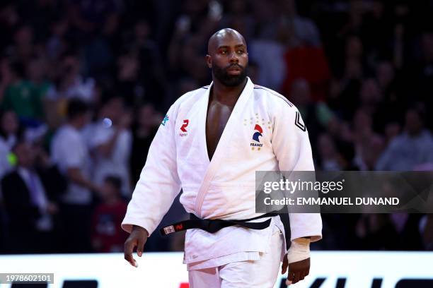 France's Teddy Riner arrives to fight against South Korea's Kim Minjong in the men's +100kg final bout during the Paris Grand Slam judo tournament in...