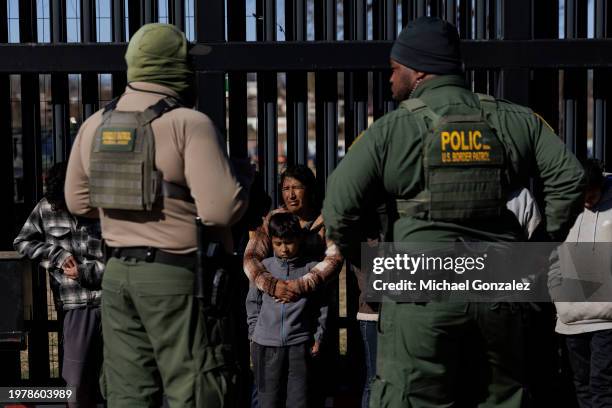 Border Patrol agents guard migrants that crossed into Shelby Park as they wait to be picked up for processing on February 4, 2024 in Eagle Pass,...
