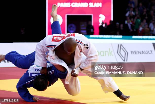 France's Teddy Riner fights against South Korea's Kim Minjong in the men's +100kg final bout during the Paris Grand Slam judo tournament in Paris on...