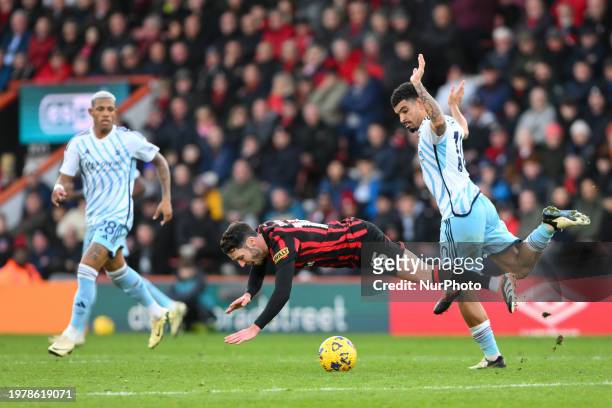 Adam Smith is battling with Morgan Gibbs-White of Nottingham Forest during the Premier League match between Bournemouth and Nottingham Forest at the...