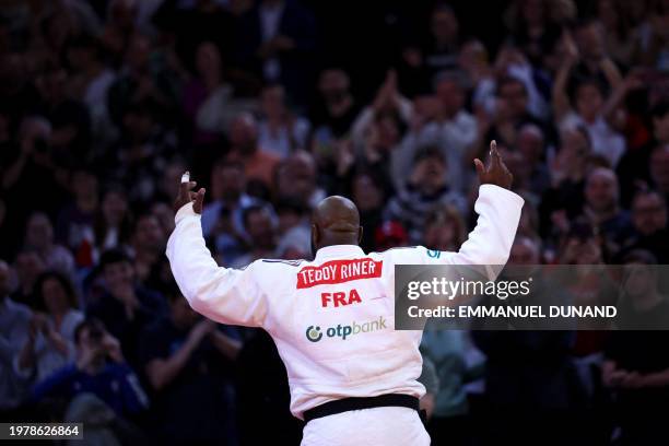 France's Teddy Riner celebrates after winning against South Korea's Kim Minjong in the men's +100kg final bout during the Paris Grand Slam judo...