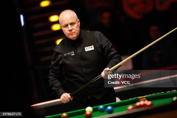 John Higgins of Scotland reacts in the fourth round match against Mark Allen of Northern Ireland on day four of 2024 BetVictor German Masters at...