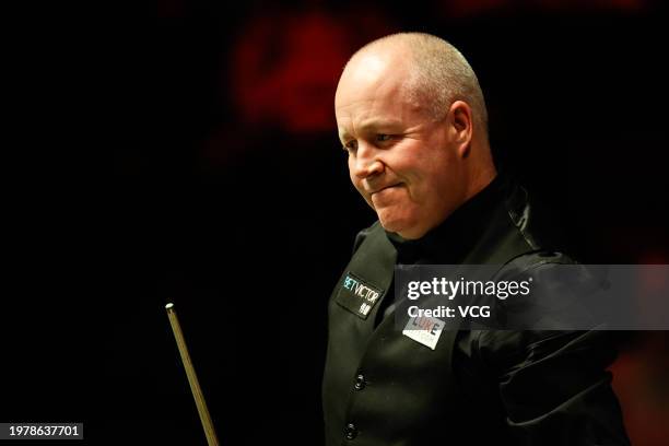 John Higgins of Scotland reacts in the fourth round match against Mark Allen of Northern Ireland on day four of 2024 BetVictor German Masters at...