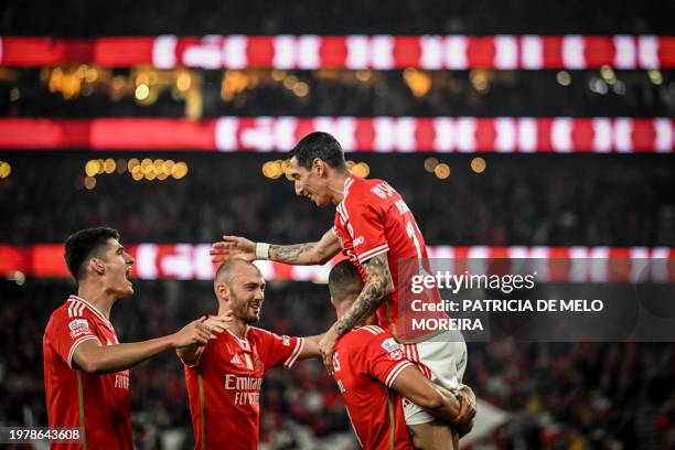 Benfica's Brazilian forward Arthur Cabral celebrates with Benfica's Argentinian forward Angel Di Maria , Benfica's Norwegian midfielder Fredrik...