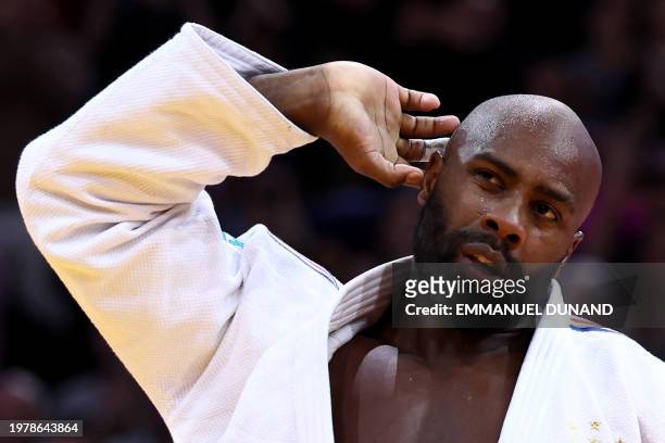 France's Teddy Riner celebrates after winning against South Korea's Kim Minjong in the men's +100kg final bout during the Paris Grand Slam judo...