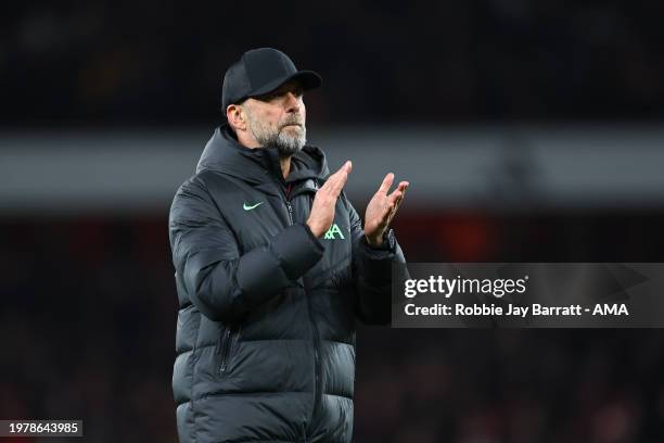 Dejected Jurgen Klopp the head coach / manager of Liverpool applauds rhe fans at full time during the Premier League match between Arsenal FC and...