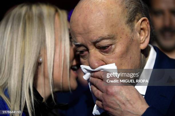 Outgoing president of FC Porto, Jorge Nuno Pinto da Costa , listens to his wife Claudia Campo at the Coliseum Theatre in Porto after presenting his...