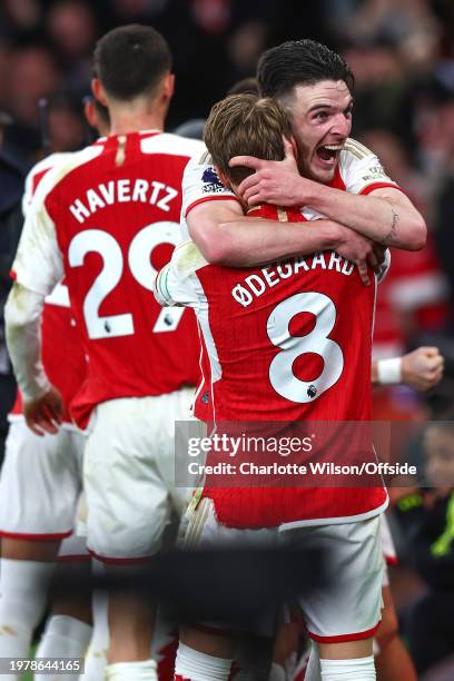 Declan Rice of Arsenal celebrates their 3rd goal with Martin Odegaard during the Premier League match between Arsenal FC and Liverpool FC at Emirates...