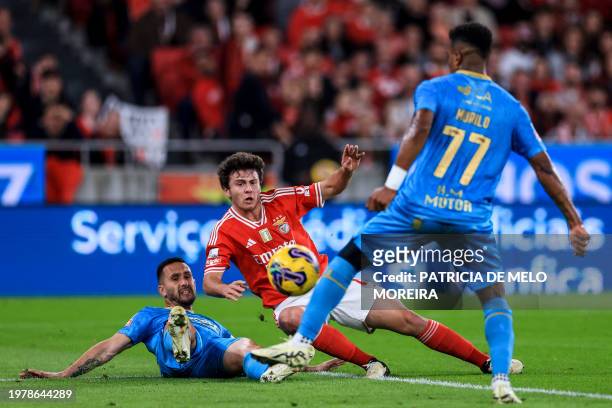 Benfica's Portuguese midfielder Joao Neves kicks the ball and scores during the Portuguese League football match between SL Benfica and Gil Vicente...