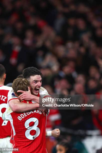 Declan Rice of Arsenal celebrates their 3rd goal with Martin Odegaard during the Premier League match between Arsenal FC and Liverpool FC at Emirates...