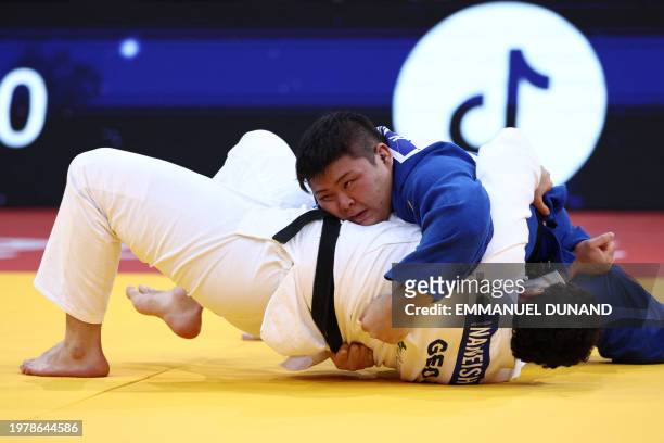 Georgia's Saba Inaneishvili fights against Japan's Kanta Nakano in the men's +100kg bronze medal bout during the Paris Grand Slam judo tournament in...