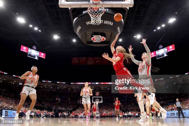 Sara Scalia of the Indiana Hoosiers slips past Rebeka Mikulasikova of the Ohio State Buckeyes to shoot the ball during the third quarter of the game...