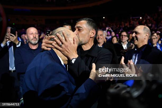 Outgoing president of FC Porto, Jorge Nuno Pinto da Costa is kissed by FC Porto's Portuguese coach Sergio Conceicao, after presenting his candidacy...