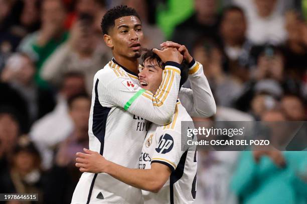 Real Madrid's Spanish forward Brahim Diaz celebrates scoring the opening goal, with Real Madrid's English midfielder Jude Bellingham, during the...