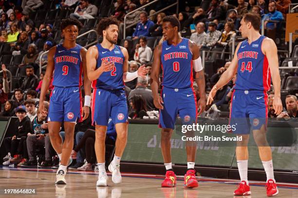 Cade Cunningham of the Detroit Pistons talks to Jalen Duren during the game against the Orlando Magic on February 4, 2024 at Little Caesars Arena in...