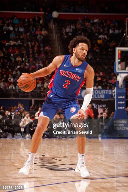 Cade Cunningham of the Detroit Pistons handles the ball during the game against the Orlando Magic on February 4, 2024 at Little Caesars Arena in...