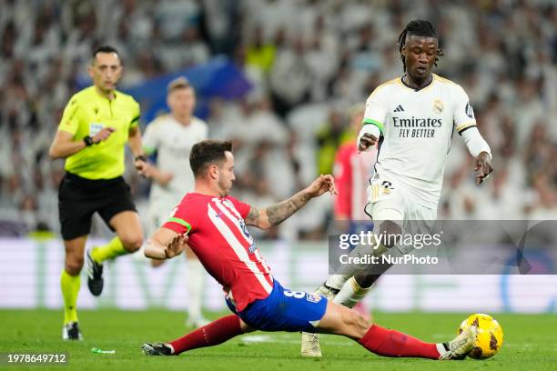 Eduardo Camavinga central midfield of Real Madrid and France and Saul Ñiguez central midfield of Atletico de Madrid and Spain compete for the ball...