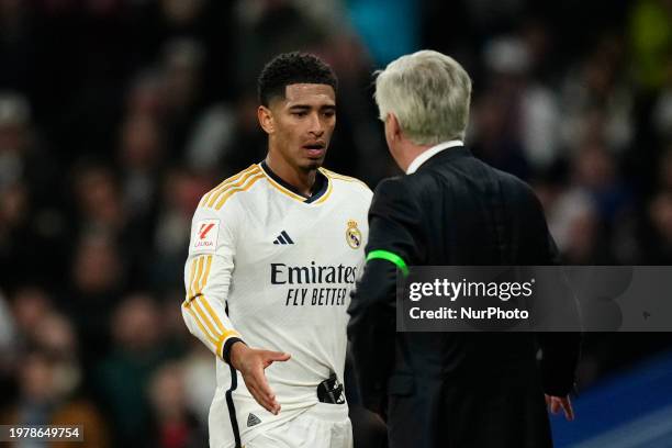 Jude Bellingham central midfield of Real Madrid and England and Carlo Ancelotti head coach of Real Madrid greet each other during the LaLiga EA...