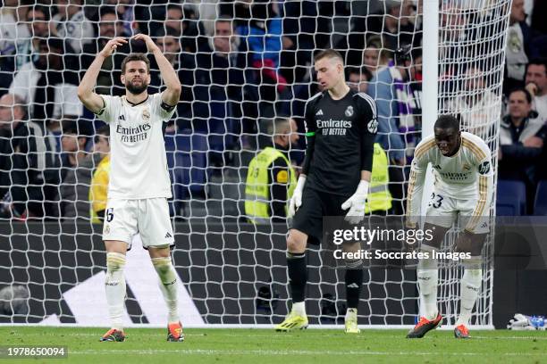 Nacho Fernandez of Real Madrid, Andriy Lunin of Real Madrid, Ferland Mendy of Real Madrid disappointed during the LaLiga EA Sports match between Real...