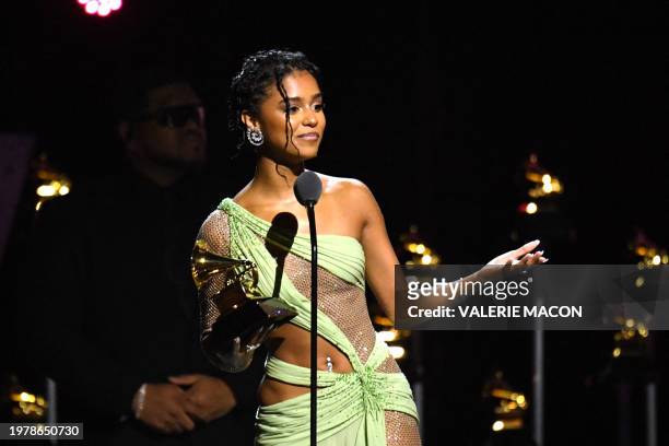 South African singer and songwriter accepts the award for Best African Music Performance for "Water" on stage during the 66th Annual Grammy Awards...
