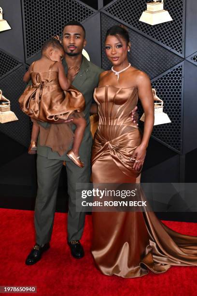 Hazel Monét Gaines , John Gaines and US singer-songwriter Victoria Monet arrive for the 66th Annual Grammy Awards at the Crypto.com Arena in Los...
