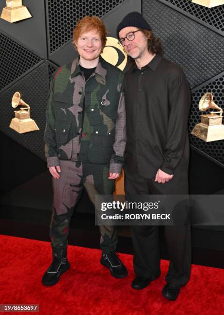 British singer-songwriter Ed Sheeran and US songwriter Aaron Dessner arrives for the 66th Annual Grammy Awards at the Crypto.com Arena in Los Angeles...