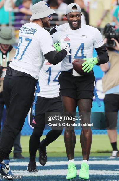 Seattle Seahawks wide receiver D.K. Metcalf celebrates with NFC Dallas Cowboys tight end Jake Ferguson after a touchdown during the NFL Pro Bowl game...