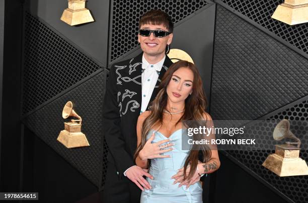 Mexican singer Peso Pluma and Nicki Nicole arrive for the 66th Annual Grammy Awards at the Crypto.com Arena in Los Angeles on February 4, 2024.