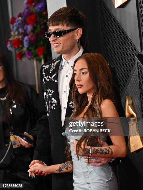 Mexican singer Peso Pluma and Nicki Nicole arrive for the 66th Annual Grammy Awards at the Crypto.com Arena in Los Angeles on February 4, 2024.