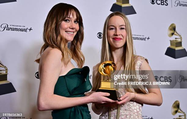 Singer Molly Tuttle and Bronwyn Keith-Hynes pose in the press room with the Grammy for Best Bluegrass Album for "City of Gold" during the 66th Annual...