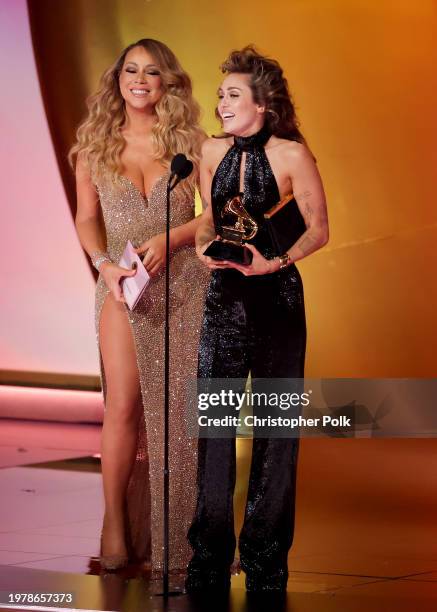 Miley Cyrus accepts the Best Pop Solo Performance award for "Flowers" from Mariah Carey onstage at the 66th Annual GRAMMY Awards held at Crypto.com...