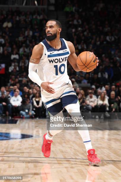 Mike Conley of the Minnesota Timberwolves dribbles the ball during the game against the Houston Rockets on February 4, 2024 at Target Center in...