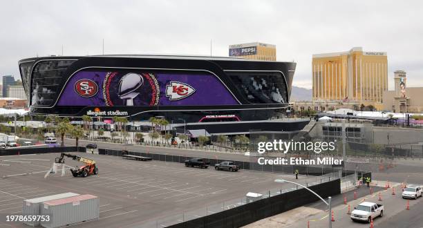 An exterior view shows an image of the Lombardi Trophy, team logos and signage for Super Bowl LVIII at Allegiant Stadium on February 01, 2024 in Las...