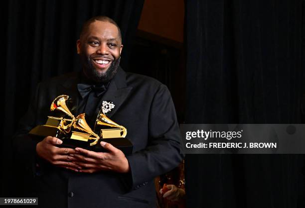 Rapper Killer Mike poses in the press room with the Grammy for Best Rap Performance, Best Rap Album and Best Rap Song during the 66th Annual Grammy...